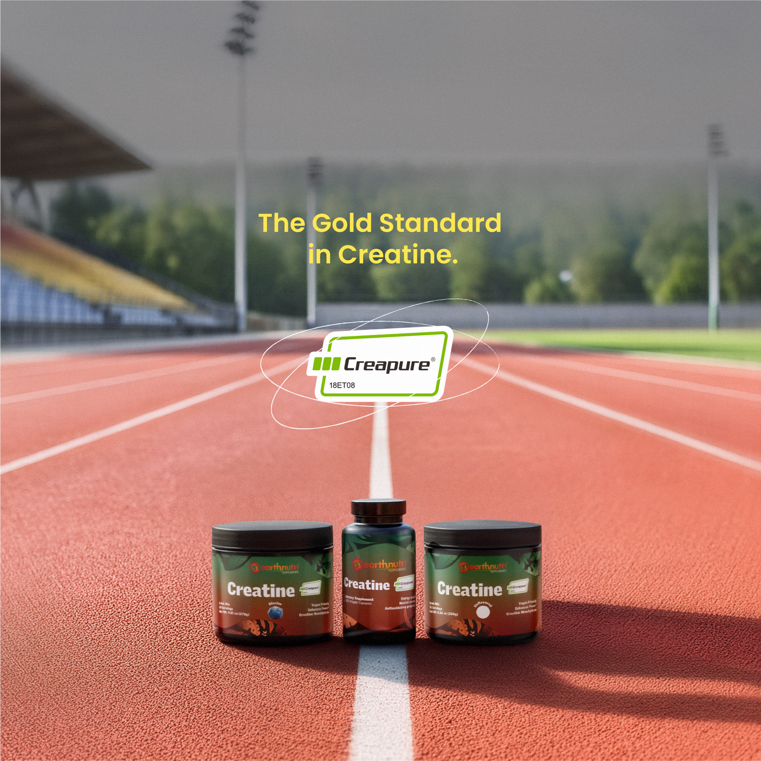 3 earthnutri Creatine products standing next to each other on a running track. Bleachers and trees in the background. On screen the Creapure logo, with the text reading, "The Gold Standard in Creatine."